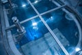 Blue glow water of nuclear reactor core powered, caused by Cherenkov radiation, fuel plates industrial uran