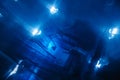 Blue glow water of nuclear reactor core powered, caused by Cherenkov radiation, fuel plates industrial uran. Blurred