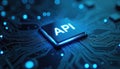 Blue glowing API chip on dark circuit board, with radiant digital data traces spreading outward. Electronic microchip powers high Royalty Free Stock Photo