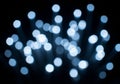 Blue glowing bokeh lights floating abstract background Royalty Free Stock Photo