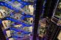 Blue glowing escalators in shopping center