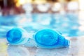 Blue goggles by the pool Royalty Free Stock Photo