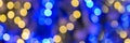 Blue and gold bokeh holidays lights at night, christmas and new year party panoramic web banner Royalty Free Stock Photo