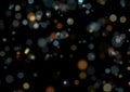 Blue and gold christmas or new year bokeh lights on a black background Royalty Free Stock Photo