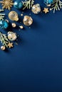 Blue and gold Christmas balls ornaments with fir branches on dark blue background. Xmas poster design, Happy New Year party Royalty Free Stock Photo
