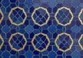 Blue and gold decorative wall tiles form a geometric pattern. Royalty Free Stock Photo