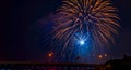 Blue and gold fireworks above bridge Royalty Free Stock Photo