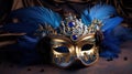 Blue and gold Venetian carnival mask with feathers, copy space