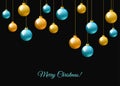 Blue and golden hanging Christmas balls on black background.