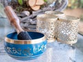 Haulerwijk - march 07 2020: Haulerwijk, The Netherlands. blue and golden indian singing bowl made of seven metals with a Royalty Free Stock Photo