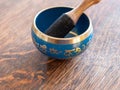 Haulerwijk - march 07 2020: Haulerwijk, The Netherlands. blue and golden indian singing bowl made of seven metals with a