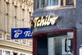 The blue and golden logos of Tchibo company at storefront which sells world-known coffee