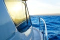 Blue golden sunrise sailing on boat side Royalty Free Stock Photo