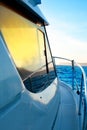 Blue golden sunrise sailing on boat side
