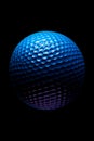 Blue golf ball with black background and reflection. Generative AI