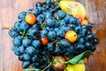 Blue grapes and pears in a vase. Fruit composition. Royalty Free Stock Photo