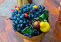 Blue grapes and pears in a vase. Fruit composition. Royalty Free Stock Photo