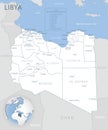 Blue-gray detailed map of Libya administrative divisions and location on the globe