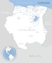 Blue-gray detailed map of Suriname administrative divisions and location on the globe