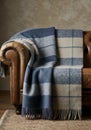 Blue and Gray Plaid Wool Throw Blanket on Leather Sofa Royalty Free Stock Photo