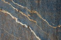 Blue gray stone with white and orange lines of pattern and texture as a nature background