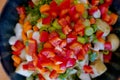 Bowl filled with peppers, green onions, and potatoes. Royalty Free Stock Photo