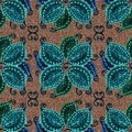 Blue and green decorative leaves on braun background