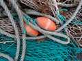 Blue Green Fishing Net and Orange Floats Display Royalty Free Stock Photo