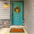 Blue green front door with a welcoming wreath Royalty Free Stock Photo