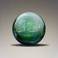 Blue green glass ball isolated on grey.