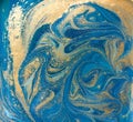 Blue, green and gold liquid texture. Hand drawn marbling background. Ink marble abstract pattern