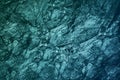 Blue green gray teal stone. Close-up. Toned rock texture background. Cracked, crumbled. Underwater, water or ice, frost effect. Royalty Free Stock Photo