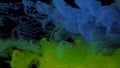 Blue, green and light green watercolor paints in water on a black background. Awesome abstract background. Beautiful wallpaper for Royalty Free Stock Photo