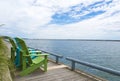 Blue and green muskoka cottage chairs by the toronto waterfront Royalty Free Stock Photo