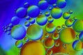 Oil drops macro colourful background Royalty Free Stock Photo