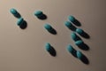 Blue-green pills on white background Royalty Free Stock Photo