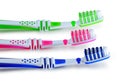 Blue, green, pink toothbrushes isolated on white background Royalty Free Stock Photo