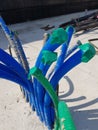 This is a blue and green pipe commonly used in house or apartment buildings to protect cables Royalty Free Stock Photo