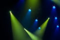 Blue and green rays of light through the smoke on stage. lighting equipment. Spotlight Royalty Free Stock Photo