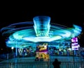 BLUE AND GREEN RIDE AS A FLYING SAUCER AT THE FAIRGROUND IN BORDEAUX