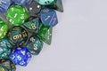 Blue and green roleplaying game RPG dice on side of gray background Royalty Free Stock Photo