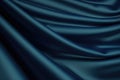blue and green silk satin soft wavy folds shiny silky fabric dark teal color elegant background Royalty Free Stock Photo
