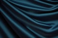 blue and green silk satin soft wavy folds shiny silky fabric dark teal color elegant background Royalty Free Stock Photo