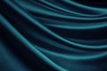 Blue green silk satin. Soft wavy folds. Shiny silky fabric. Dark teal color elegant background with space for design. Royalty Free Stock Photo