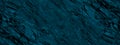 Blue green stone background. Dark turquoise toned monochrome rock texture. Close-up.