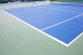 Blue and green tennis court surface,Tennis ball on the field Royalty Free Stock Photo