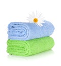 Blue and green towels and camomile flower Royalty Free Stock Photo