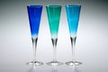 Blue and green trio of champagne glasses Royalty Free Stock Photo