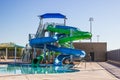 Swimming Pool With Two Tube Slides In Early Morning