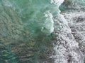 blue and green waves crashing against the reef making a beautiful natural pattern Royalty Free Stock Photo